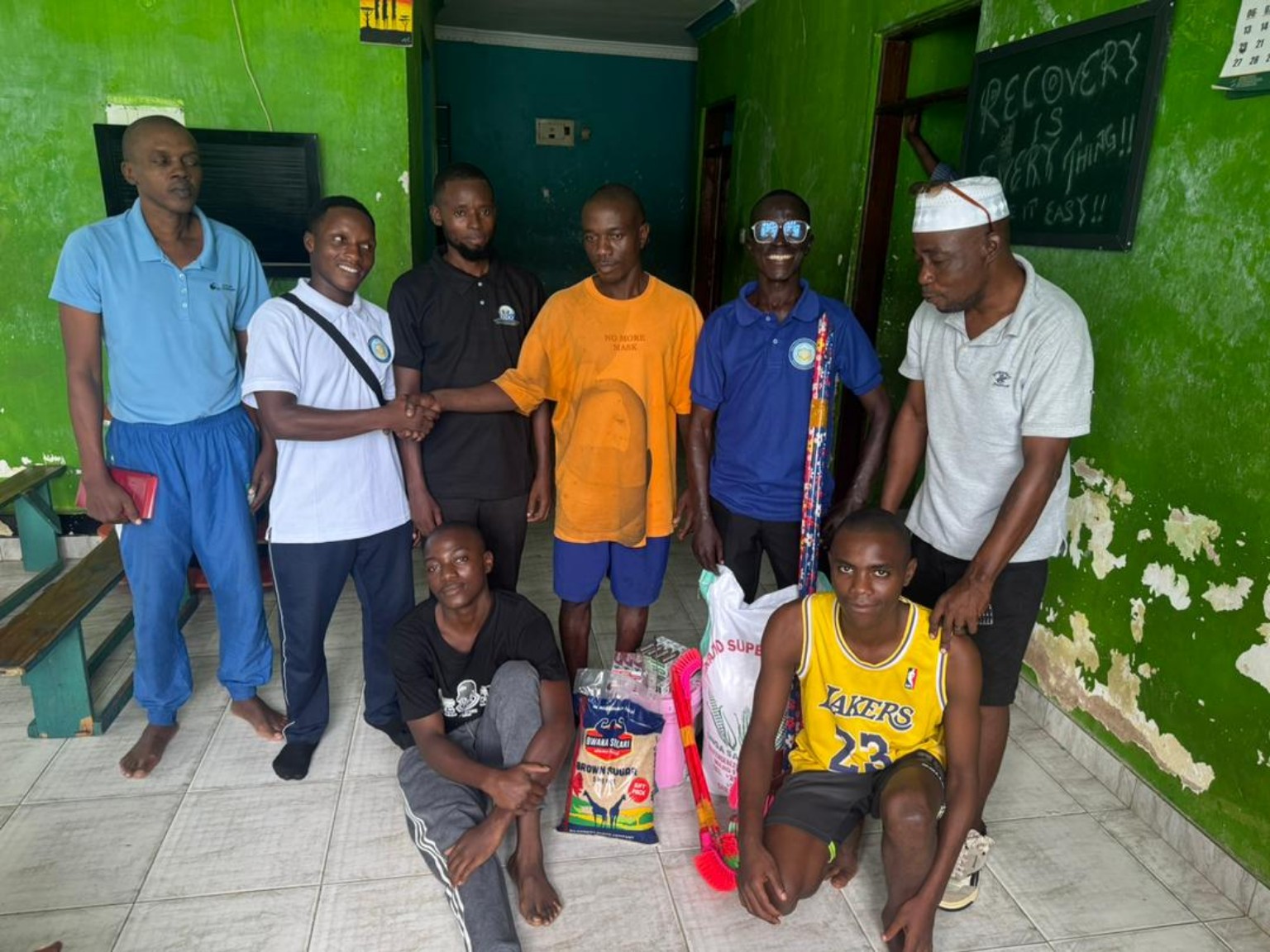 Participants and RSDO representatives with donated food and hygiene supplies